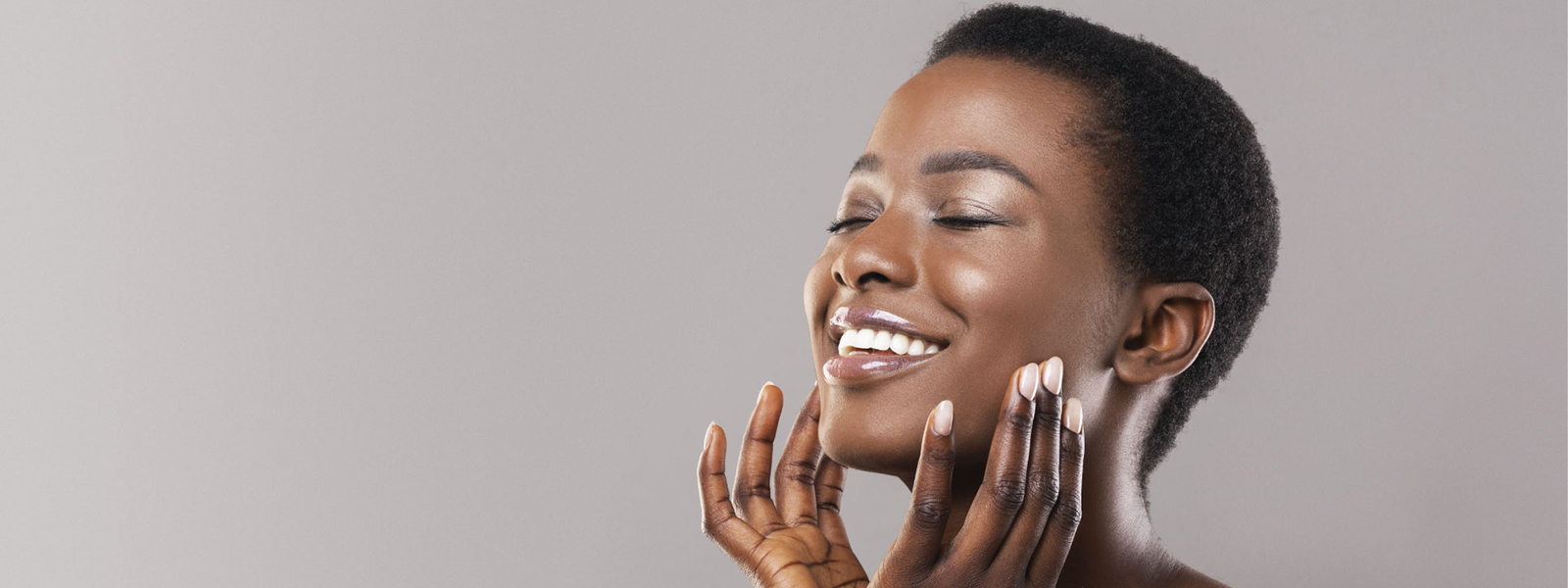 banner photo female model with her eyes closed and hands to her lower face