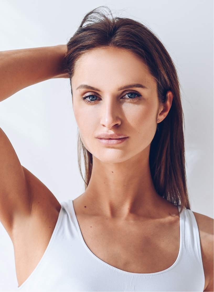 Beautiful woman with her hand on her head