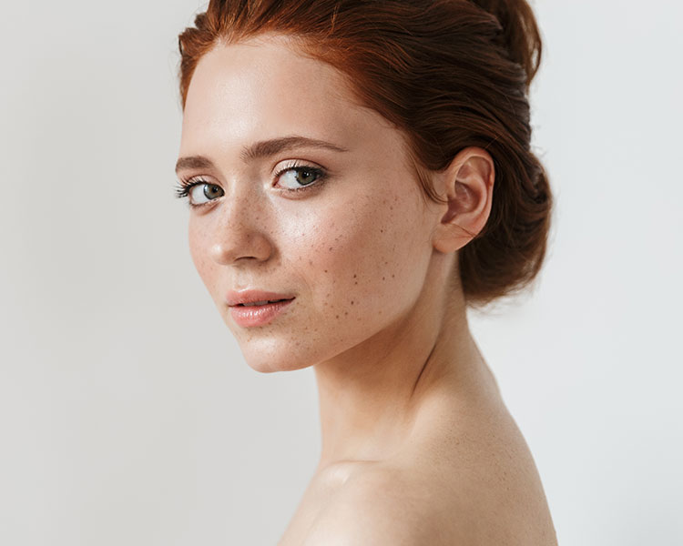 Pensive female model looking over her shoulder - mobile