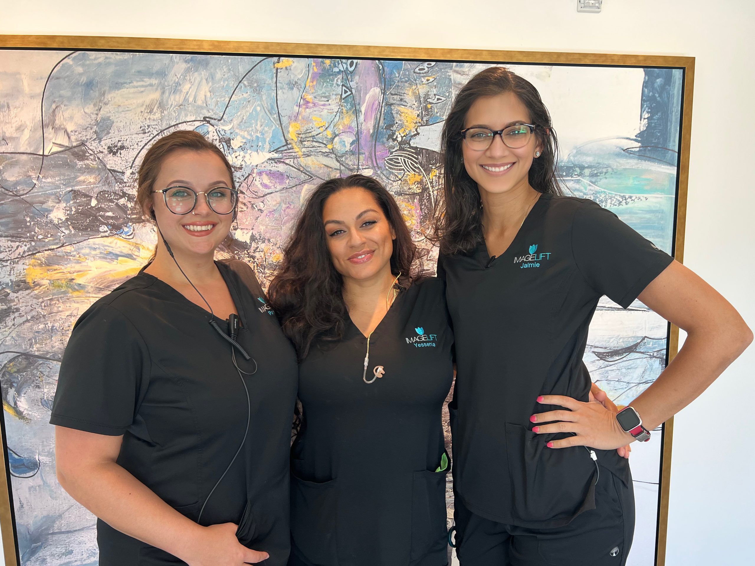 Imagelift staff in front of a painting